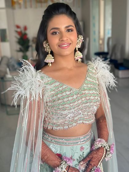 Another beautiful shot of this modern Mehendi look, showcasing the flawless skin and soft, flattering makeup tones.