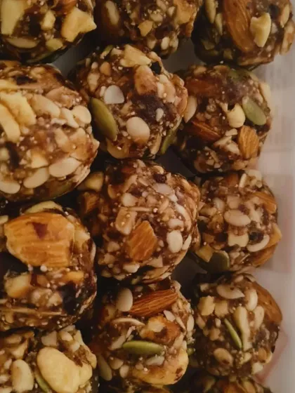 A close-up of my sugar-free Dry Fruit Laddoos. Each one is packed with kaju, badam, pista, sunflower seeds, pumpkin seeds, dates, and poppy seeds for a healthy and energizing snack.