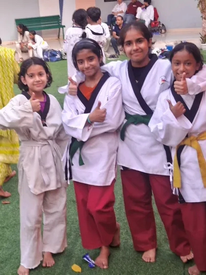 Our Poomsae team, ready for competition. Poomsae, or forms, is a core part of Taekwondo that requires immense precision and discipline.