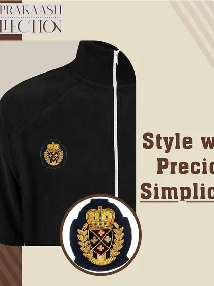 A simple black jacket is styled with a small, intricate crest patch. This demonstrates how even a small embellishment can add a touch of precious simplicity and individuality to your look.