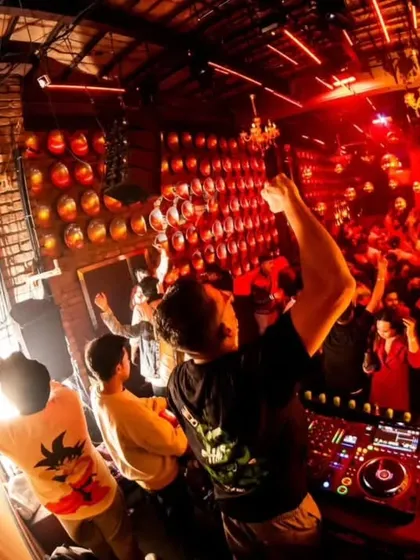 A fisheye view from behind the decks at Roxy, showing the entire club going wild. This perspective really captures the intensity of the night.