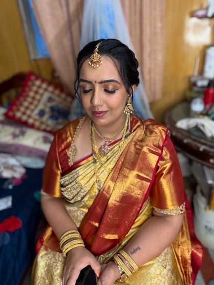 Another shot of the getting-ready process. Even before the final touches, her skin looks flawless and radiant with the HD base.