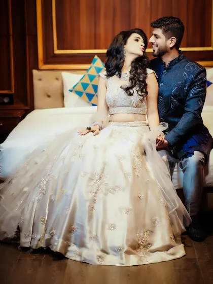 A playful and romantic moment between the couple during their reception photoshoot.