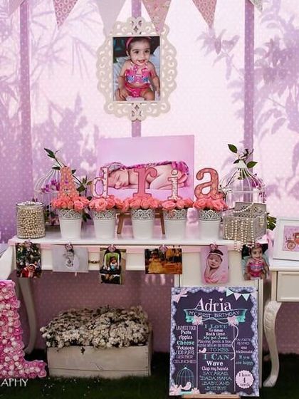 A vintage-style princess birthday corner. I used ornate photo frames, classic furniture, and a personalized chalkboard to create a charming and personal space.