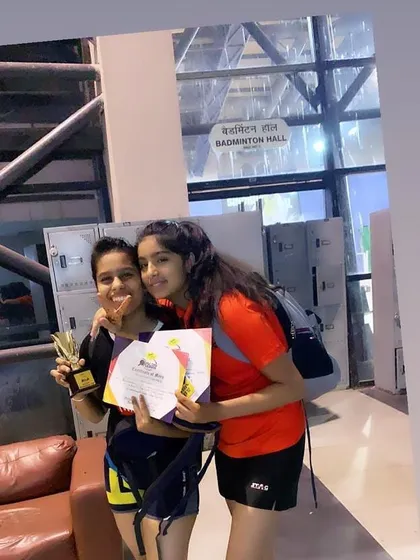 Aditi and Tamanna celebrating their wins at the 'Born to Play' tournament. Aditi achieved 2nd place in mixed doubles and 3rd in the U-18 singles, showcasing her versatility and skill.