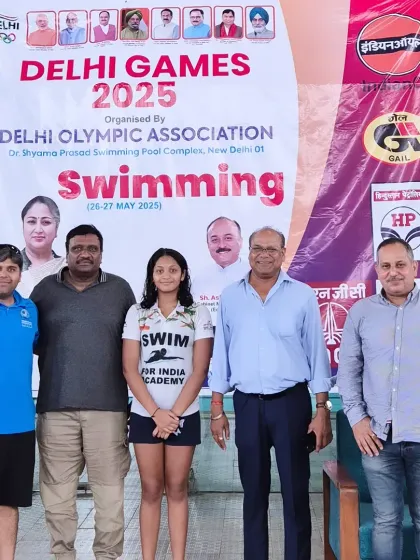 The support system behind the swimmer. Amiera with her family and me at the Delhi Games 2025.