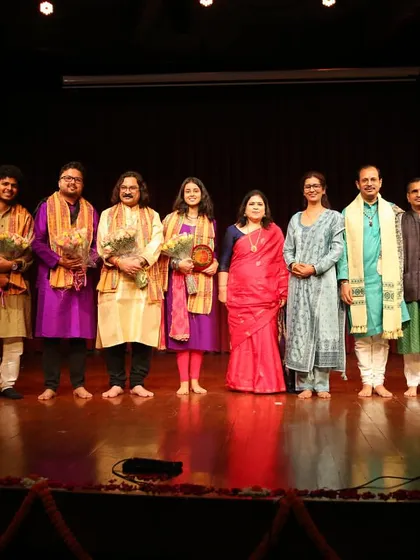 The entire group of artists and organizers on stage at the Debadhara Festival.