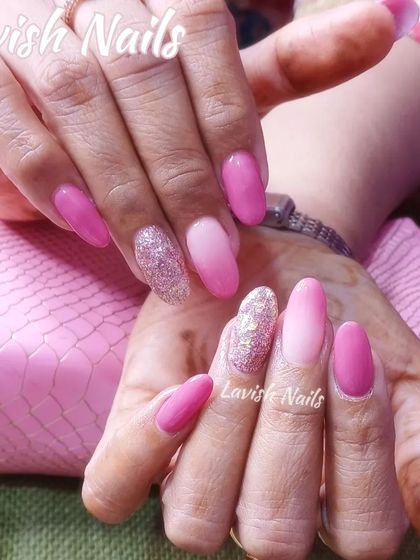 A pretty-in-pink set with solid pink, pink ombre, and a sparkling pink glitter accent nail.