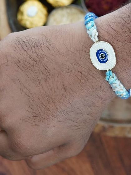 The blue Evil Eye Rakhi, an almost sold-out piece! It's a customer favorite.