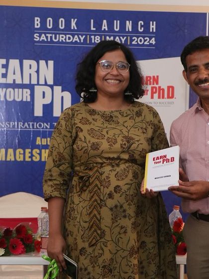A proud moment for our community as BWWer Magesh Kumar presents his newly launched book, 'Earn your Ph.D.', to his classmate and guest of honor, Devkanya Chakravarty.