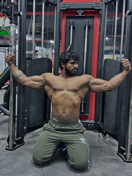 A kneeling front double bicep pose. This variation allows for a different look at the upper body.