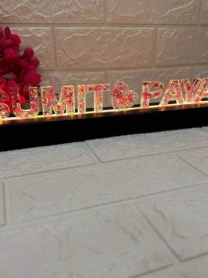 An angled shot of the lit name stand, showing the glow it casts.