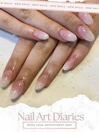 This angle highlights the elegant almond shape of the nails, which works perfectly with the glitter ombre design. It's a sophisticated look for any celebration.