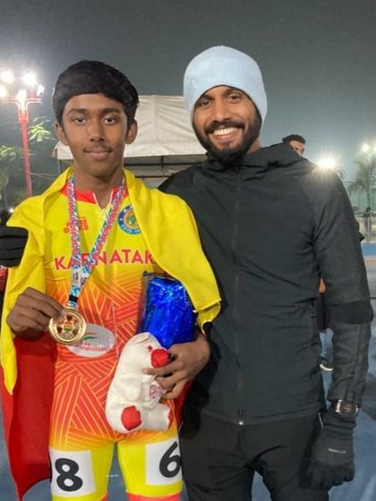 Posing with a young champion and his well-deserved medal. Seeing my skaters achieve their goals is what drives me.