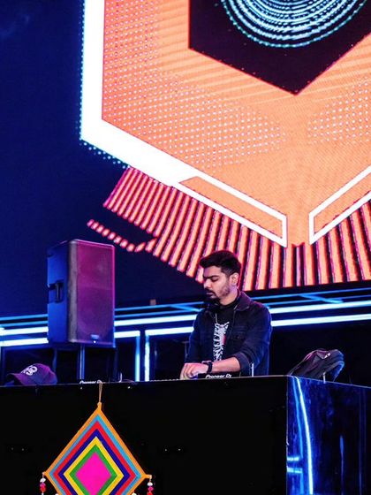 At the console at White Lotus Club, with the massive LED screen behind me. The production here allows for an amazing audio-visual show.