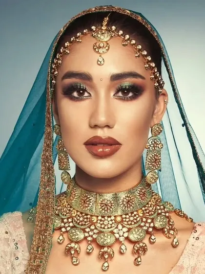 A high-fashion bridal look with a mint-meena Kundan choker and a contrasting blue dupatta. This shows how my jewellery can be styled for a contemporary, editorial feel.