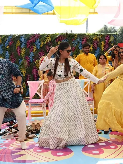 A candid shot of me dancing with a guest. These spontaneous moments of connection are what make my job so rewarding.