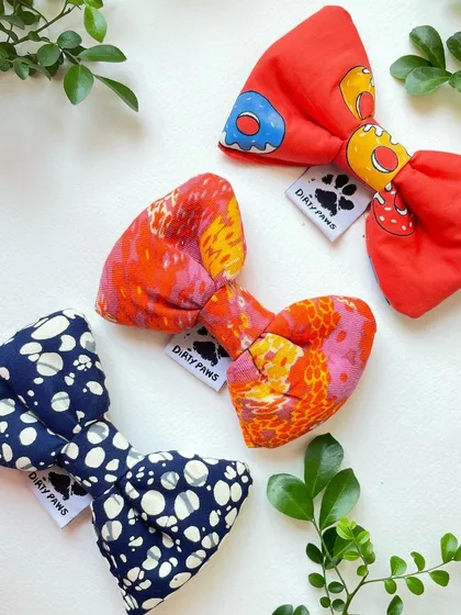 A collection of three of my handmade dog bows in unique, colorful prints. These bows are easy to attach to any collar and instantly add a touch of charm.
