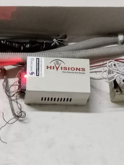 This is the power supply unit for the electronic door lock. We ensure it is installed safely and provides consistent power to the locking mechanism.