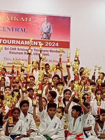 A moment of pure joy. All the winners from the tournament holding their trophies high. The hard work has paid off.