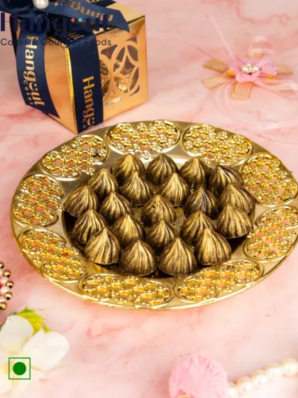 Celebrate the festive spirit with a healthy twist. This platter holds 21 of my sugar-free chocolate modaks, offering a delicious and guilt-free way to enjoy the festival with family and friends.