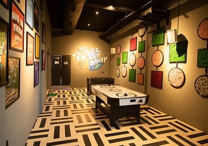 The game room at Dank, where we used preserved moss art on the walls. This is a low-maintenance way to bring color, texture, and a natural element into an indoor recreational space.