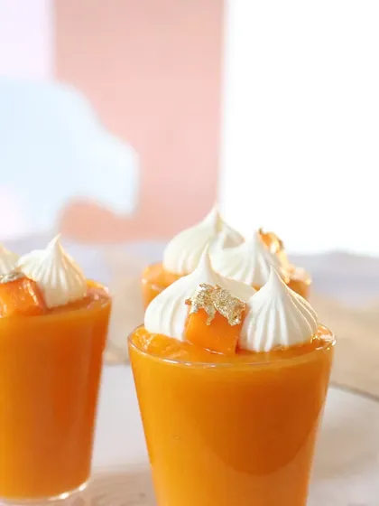My elegant Aamras Shots, a modern take on the classic mango dessert, topped with cream and edible gold leaf.