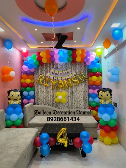 A colorful Chota Bheem theme for a 4th birthday. This setup uses a multi-color balloon arch and character pillars to celebrate with India's favorite cartoon hero.