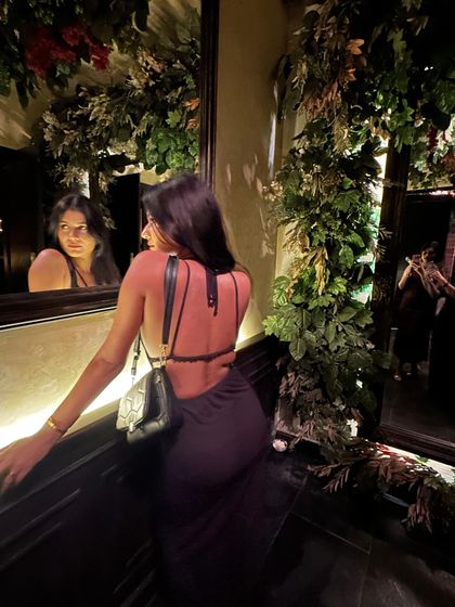 The full back view of the dress. A well-placed detail can transform a simple black dress into a showstopper.