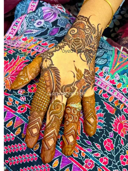 A single-hand design with intricate finger work and a floral wristband.