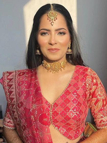 Another angle of the Godh Bharai makeup, capturing the beautiful sunlight on her glowing skin. The look is fresh, minimal, and perfect for a daytime celebration.