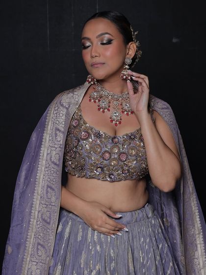 A serene shot of the model, highlighting the elegance of the jewellery.