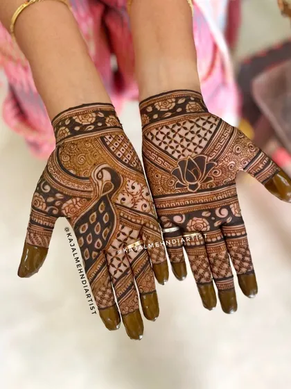 A trendy design for the bridal party, featuring a bold peacock on one hand and a lotus on the other.