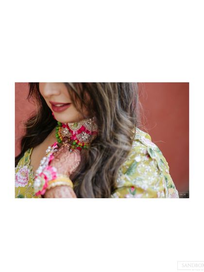 A series of artistic and candid shots of the bride and groom, showcasing their outfits and the beautiful outdoor venue.