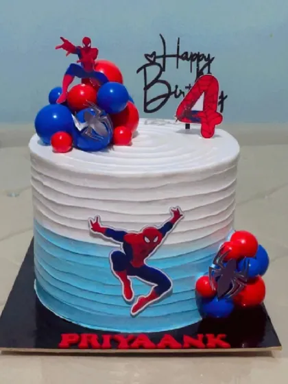 This is another view of the popular Spiderman-themed cake, showing the clean lines and vibrant colours. I can customize any superhero cake with names and ages to make your child's birthday extra special.
