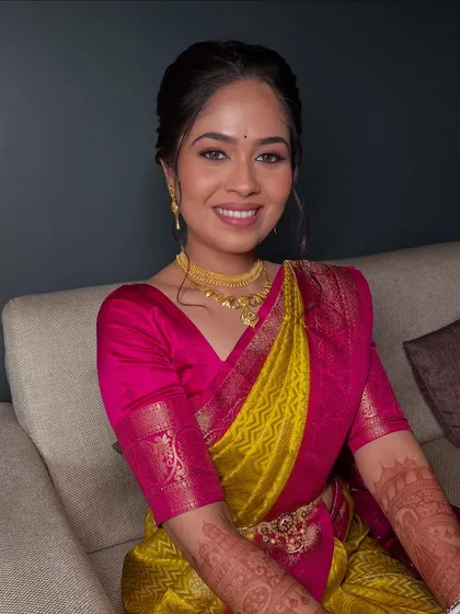 A happy and confident bride, showcasing her natural-looking makeup that is perfect for a day-time wedding event.