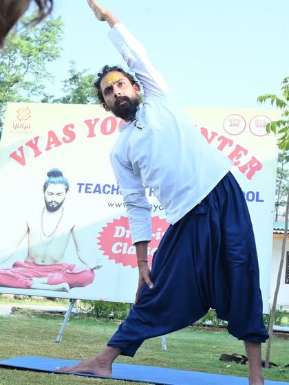 Celebrating International Day of Yoga. Here I am, demonstrating Trikonasana (Triangle Pose) during an outdoor class, finding balance and peace.