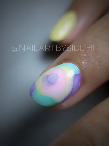 A close-up of a pastel blooming flower effect, where colors blend together like a watercolor painting.