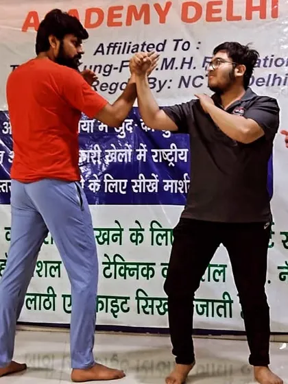 Students practicing hand-to-hand combat drills. They are learning to read an opponent's moves and react instantly. This is the core of our freestyle training.