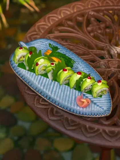 A beautiful Uramaki roll, with creamy Hass avocado and whipped cream cheese, given a kick with jalapeño cream.