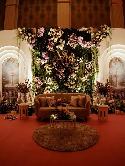 The same garden stage design, but with different lighting to create a warmer, more dramatic mood for an evening event.