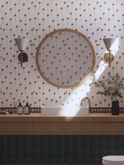 This bathroom in our Goa project has a playful, tropical feel. I used a palm tree-patterned wallpaper and vibrant blue-green tiles to create a space that is fun, fresh, and perfect for a holiday home.