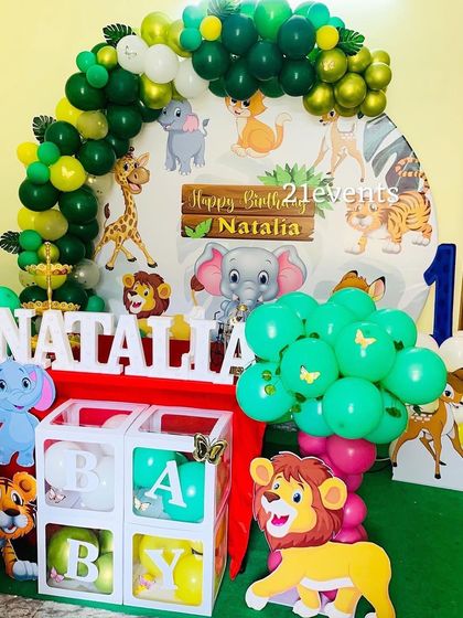 A cute cartoon jungle theme with 'BABY' blocks, perfect for a first birthday.