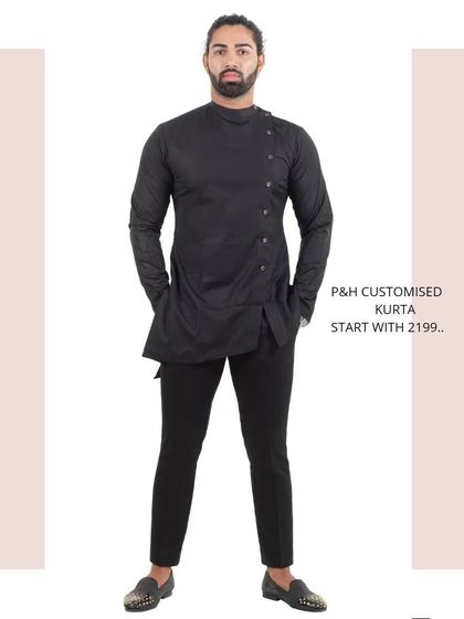 A custom-designed black kurta with a modern, asymmetrical cut and side-button placket. This is a stylish choice for a festive or party look.