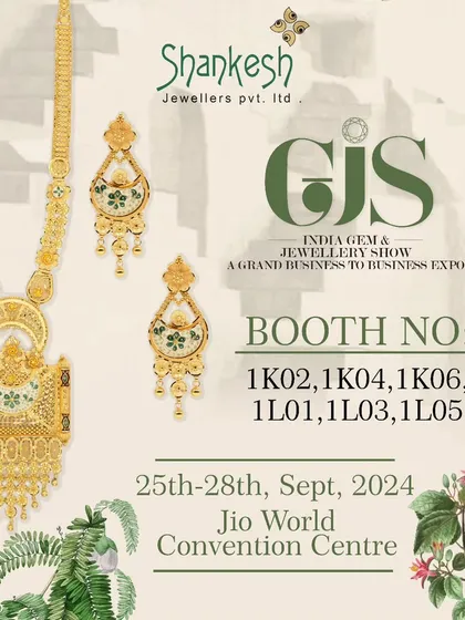 A long gold necklace set with delicate green enamel work. This piece offers a subtle touch of colour and a sophisticated design, perfect for customers with refined taste.