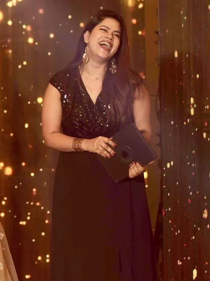 A candid shot of me laughing on stage. Genuine fun is contagious, and I always make sure to have as much fun as the guests.