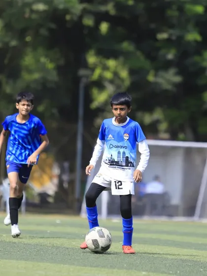 A young player in our U13 squad maintains possession and looks for an opening.