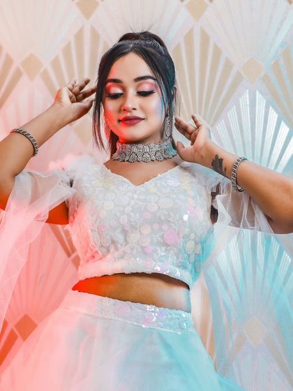 This series of photos and video shows a model in a modern white lehenga, wearing our diamond-look choker set. It's a perfect look for a sangeet or cocktail party.