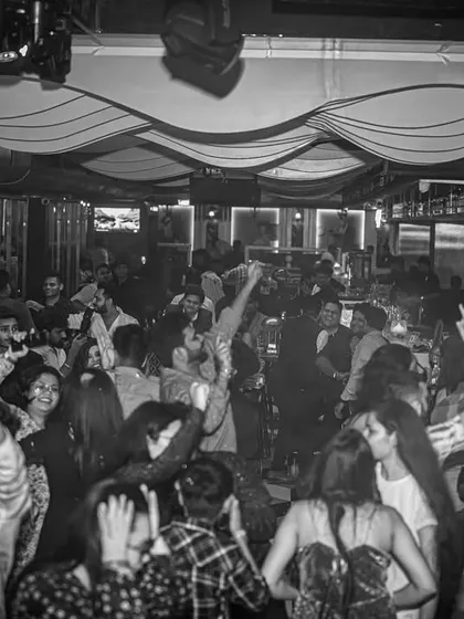 The entire club was moving as one. This black and white photo perfectly captures the collective energy of a great night.