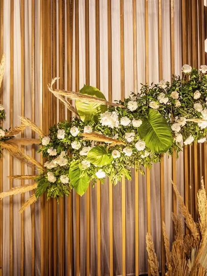 The unique floral design on the slatted mandap wall. This detail shows my approach to creating custom, artistic elements that elevate the overall decor.